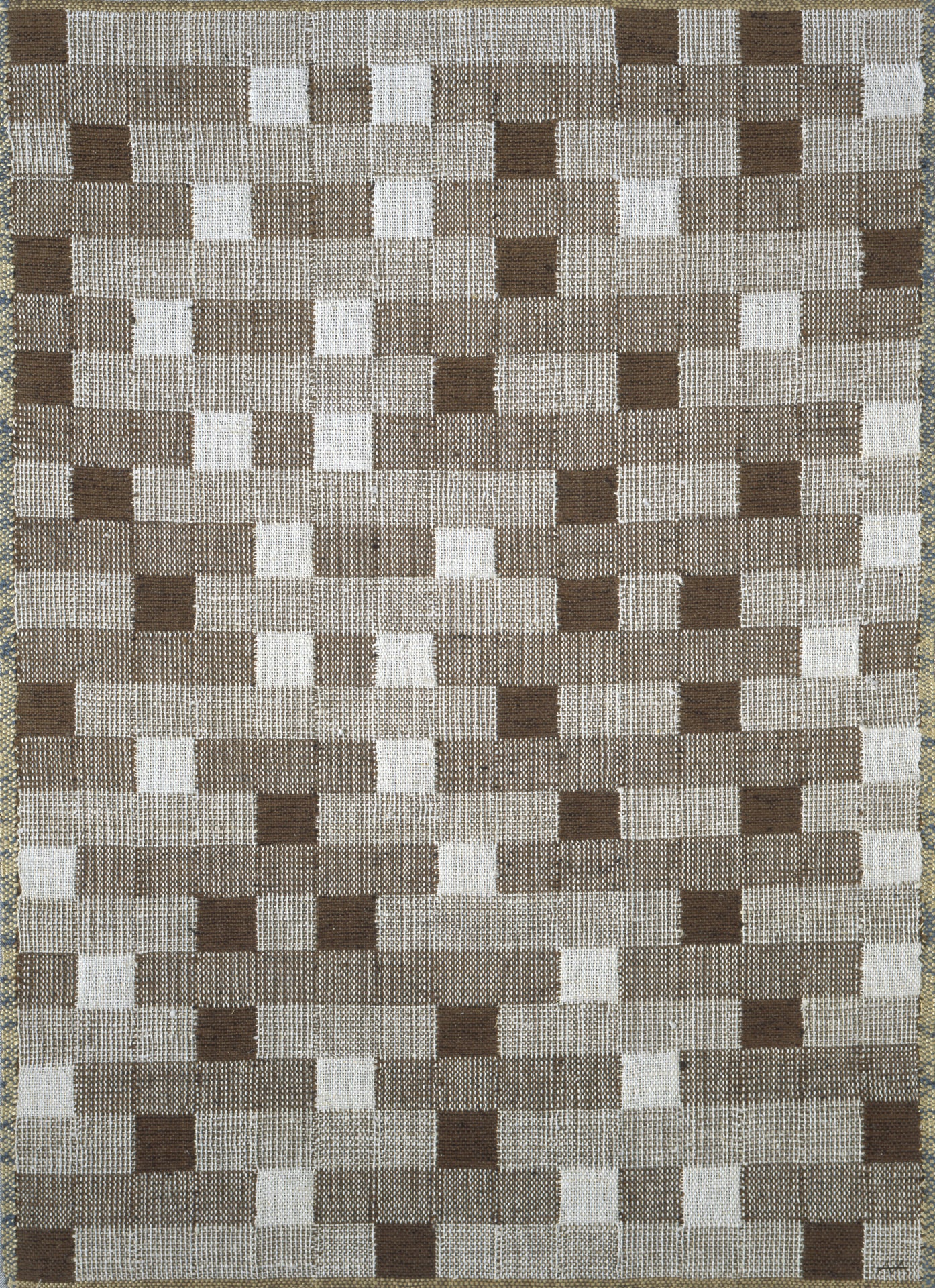 a tapestry with checked grey and brown squares