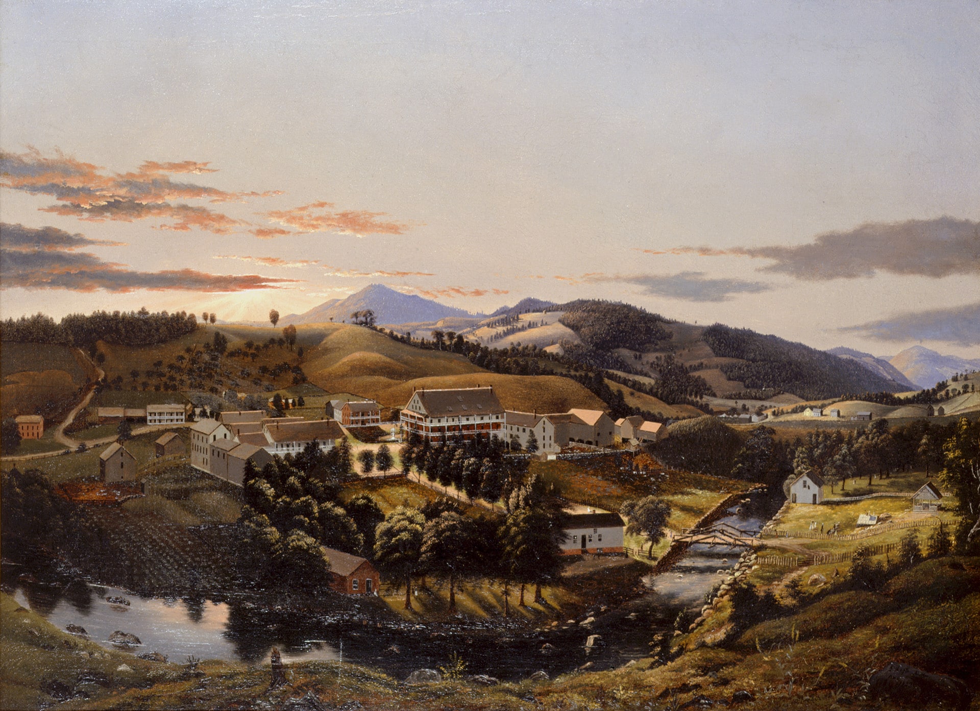 a landscape with mountains, a river, and buildings seen from a birds-eye view