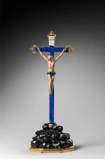 a blue crucifix with a crucified christ hanging