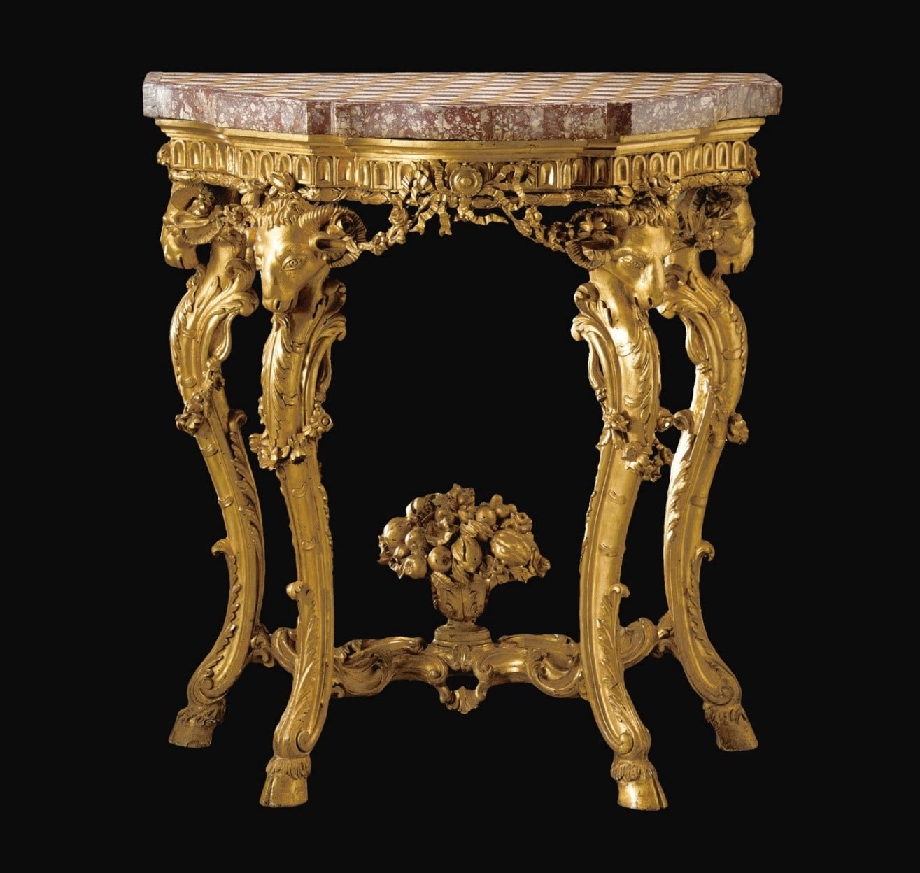 a decorative side table with a marble top and carved legs in the shape of rams