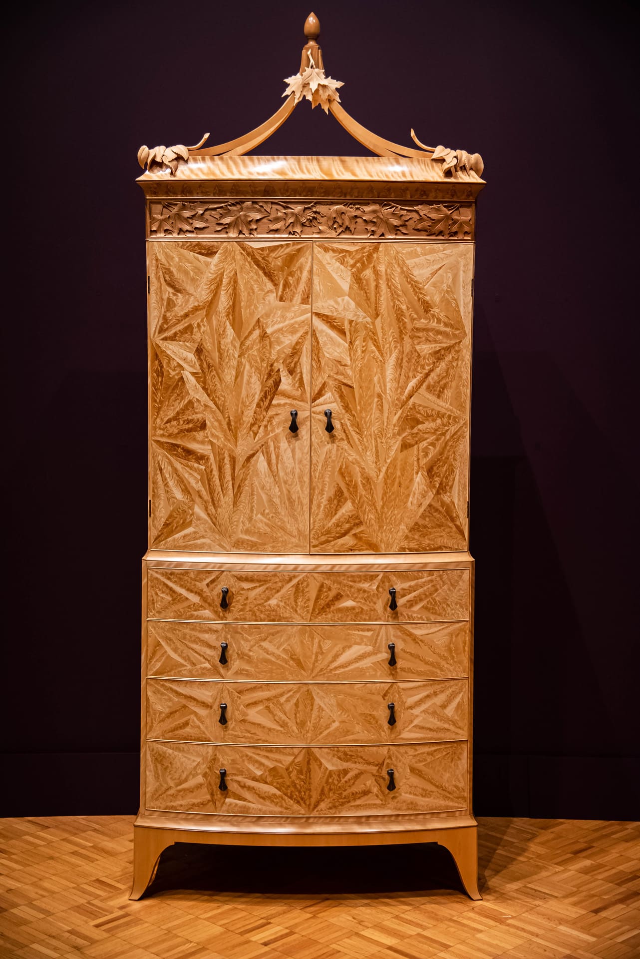 a tall ornate secretary chest