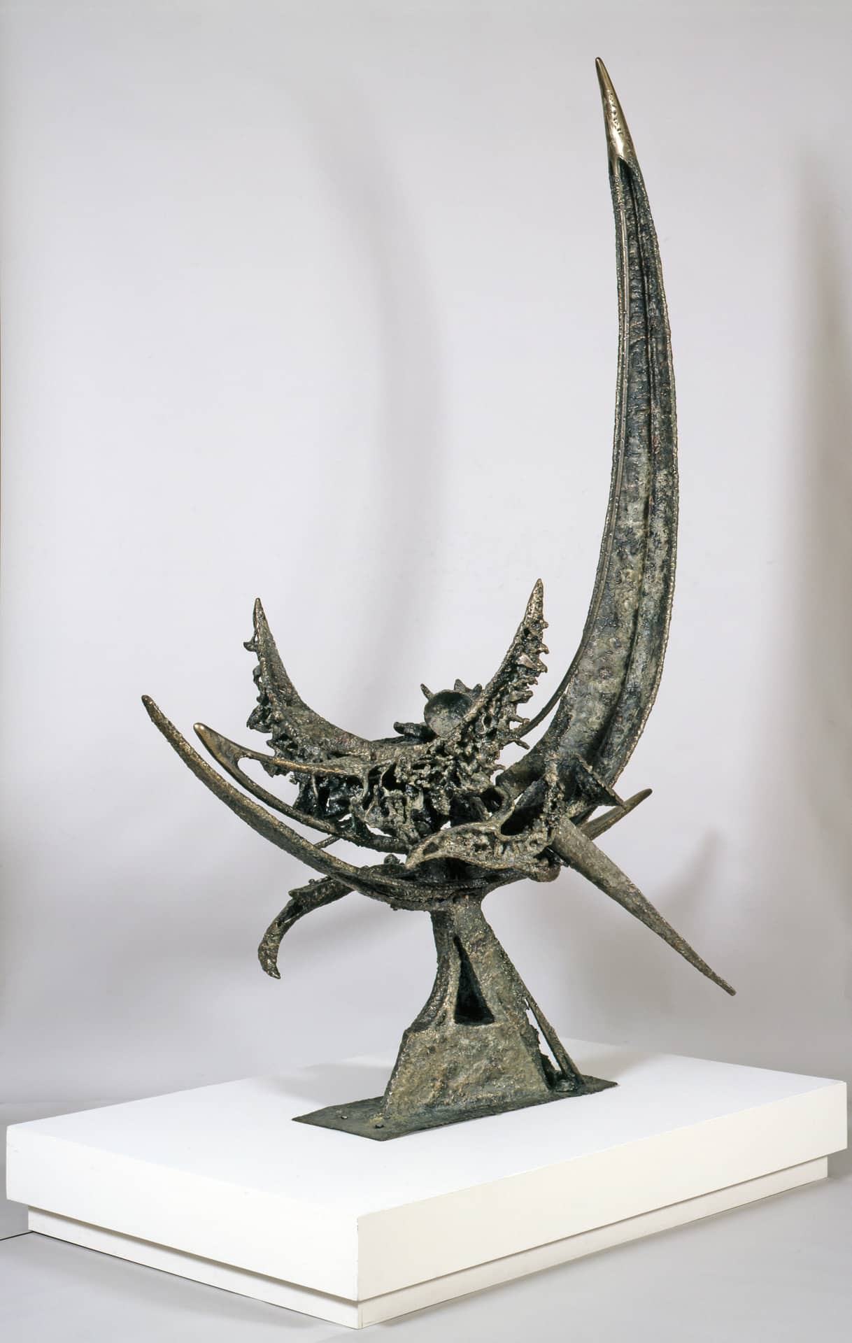 a steel half moon-shaped sculpture