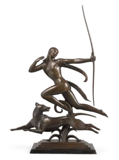 a bronze sculpture of a nude goddess diana with a bow and a wolf by her side, both are running