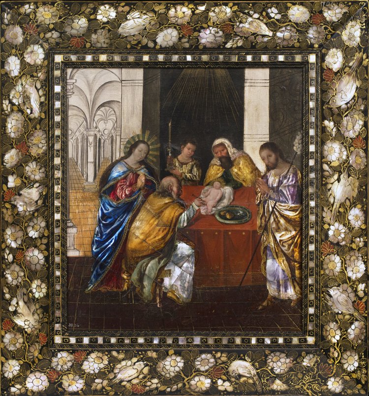 a painting of 5 figures performing a circumcision on the Christ child. A frame decorated with flowers surrounds the painting.